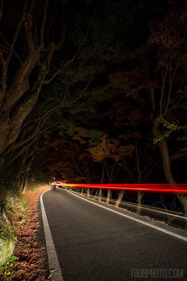 f/5.6, ISO 400, driving away from camera. Lit with only headlights.